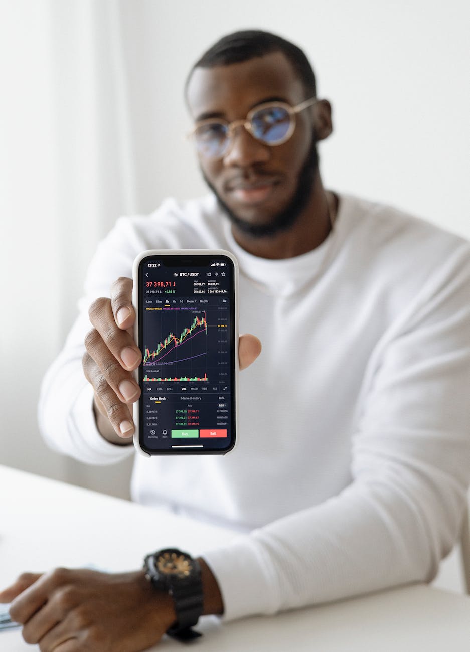 man holding black smartphone