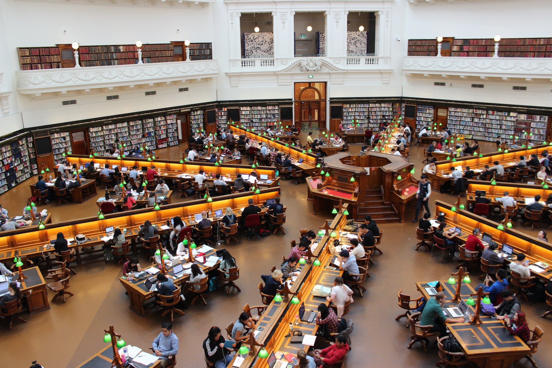 People sitting inside well-lit room, stock exchange for which brokerage account is best for beginners on arablelife.com