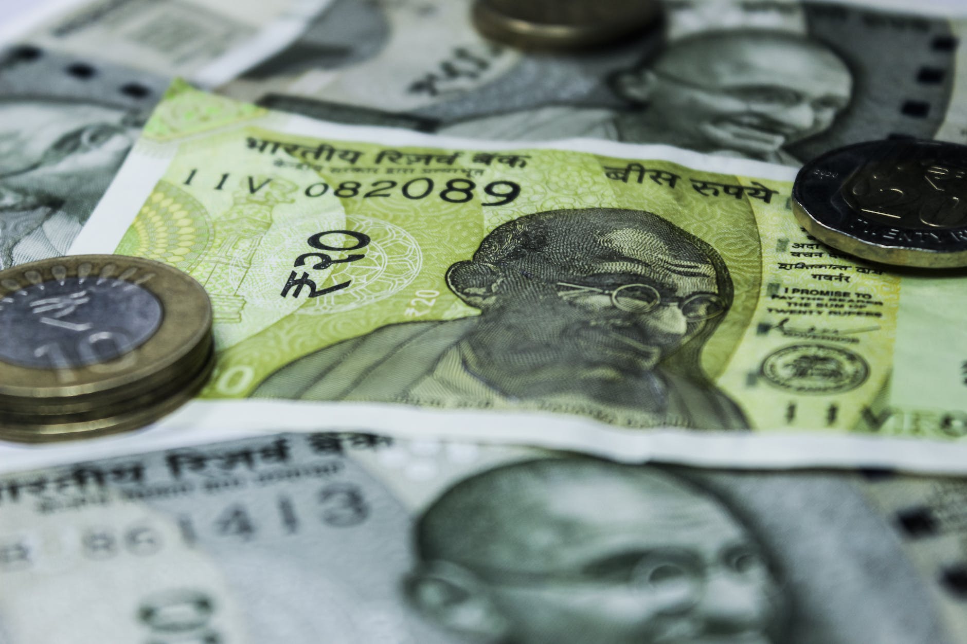 yellow and white bank note in close up shot, indian rupees explaining pricing of the brokerage account in accounts required to invest in the share market.