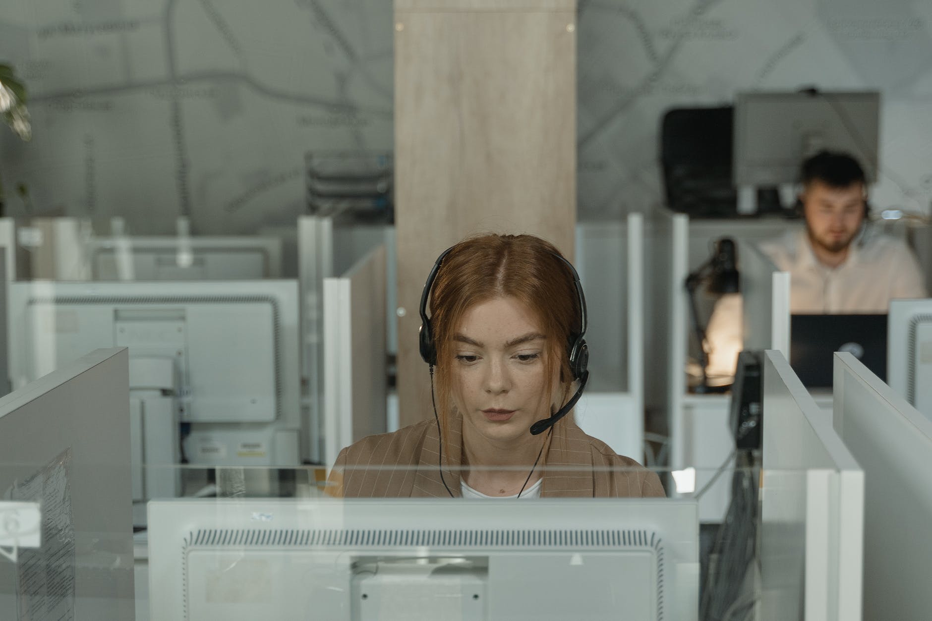 a woman in brown blazer working in the office, customer support woman working in accounts required to invest in the share market.